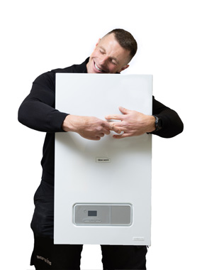 A tall man hugging a boiler